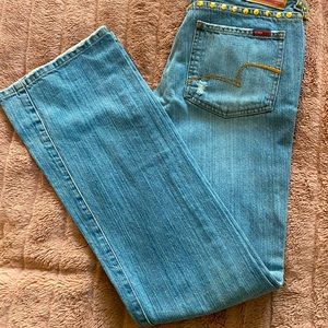 Vintage Y2K flare jeans with gold detail.